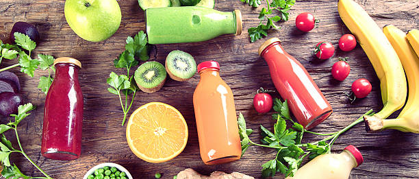 Fresh smoothie and juices with vegetables and fruits.