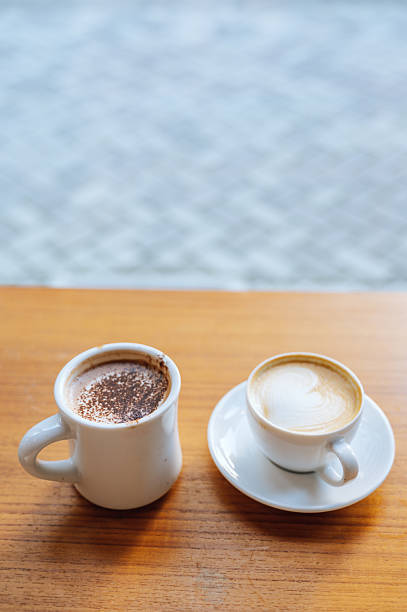 Close-up latte and hot mocha on wooden table
