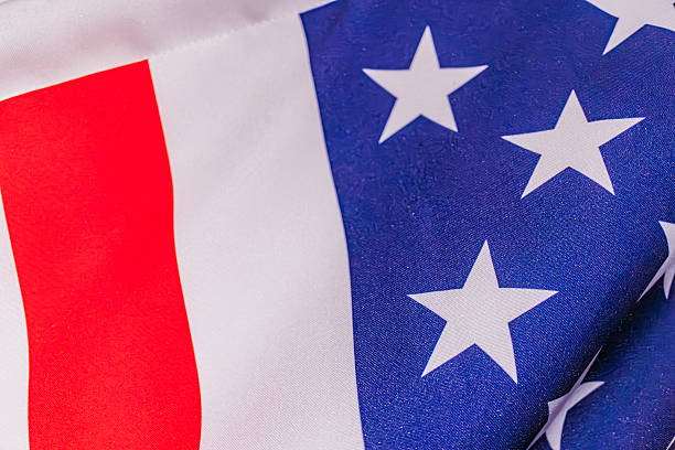 istock Close-up, slightly blurred, American flag, star field, stripes, blue, red, white background, central perspective, densely packed stars, overhead light source, no texts or people 2214010616