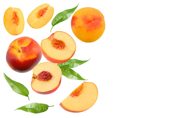 istock Piece of nectarine with leaves isolated on white background. clipping path 2214012633