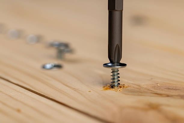 istock screw for fixing wooden boards twisted into a pine board 2214013176