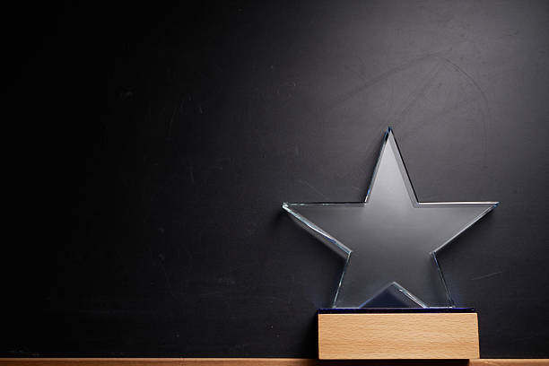 istock star shape crystal trophy against blackboard 2214013958