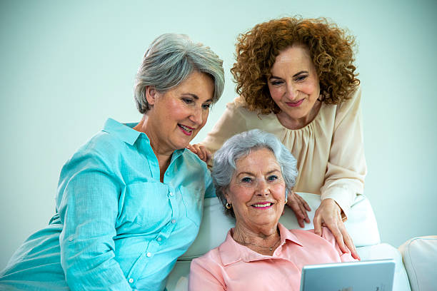 istock Senior Mother and two daughters portrait 2214014247