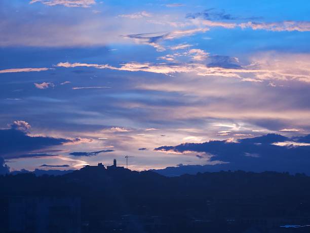 Sunset among the city hills