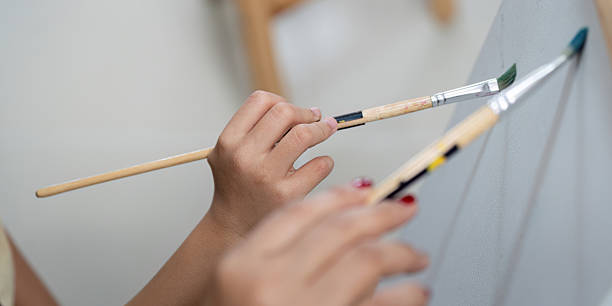 istock Creative activity with mother and daughter painting together 2214017812