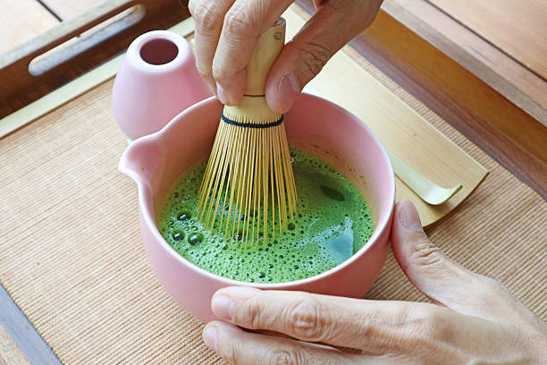 istock Whisking Japanese Matcha Tea Powder with CHASEN 2214018441