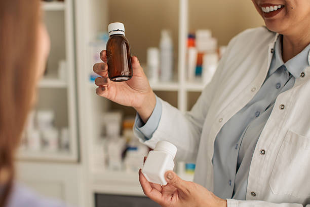 istock Pharmacist recommending products to a customer in a pharmacy 2214024338