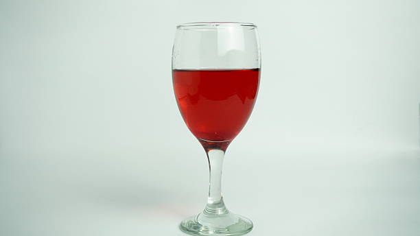 istock a glass of wine with a red liquid inside of it 2214024744