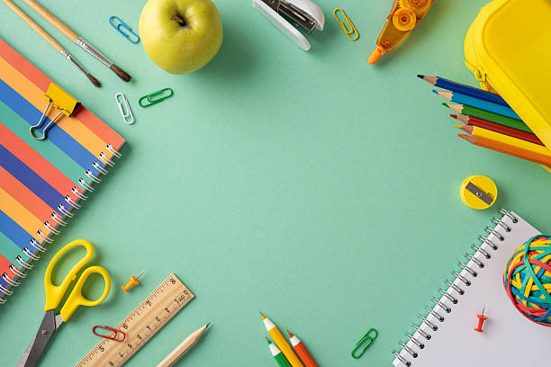istock Various school supplies and stationery items creatively arranged on a vibrant mint green surface, suggesting a back-to-school concept 2214025614