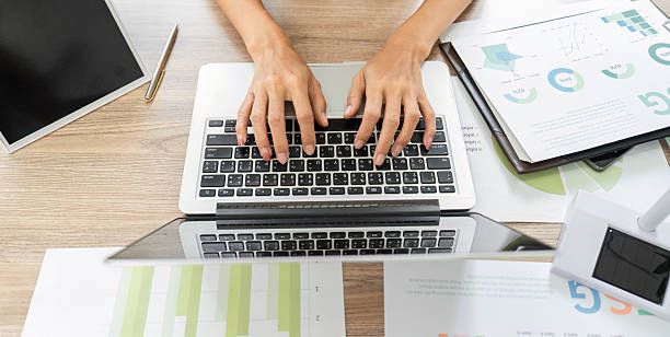 istock ESG sustainability analyst working on a laptop in a modern office 2214026934