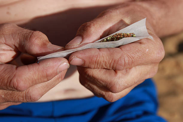 making joint marihuana beach relax taboo smoking