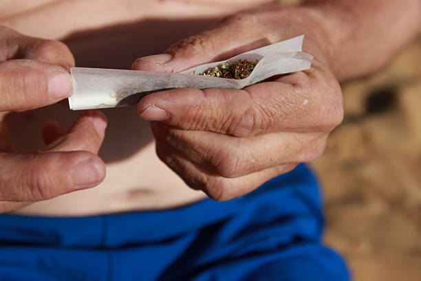 making joint marihuana beach relax taboo smoking