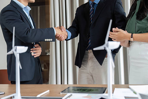istock ESG Collaboration: Business professionals shaking hands for sustainability 2214031752