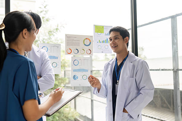 istock Doctors collaborating on healthcare strategies with data visuals 2214031987