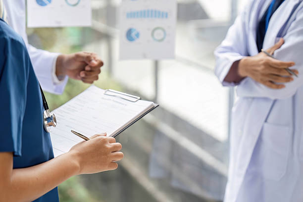istock Doctor discussing patient care strategies with engaging visuals 2214032043