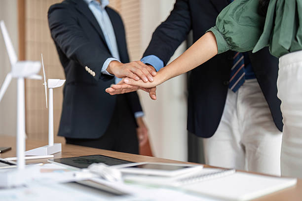 istock ESG and Sustainability: Close-up of hands symbolizing teamwork and partnership 2214032276