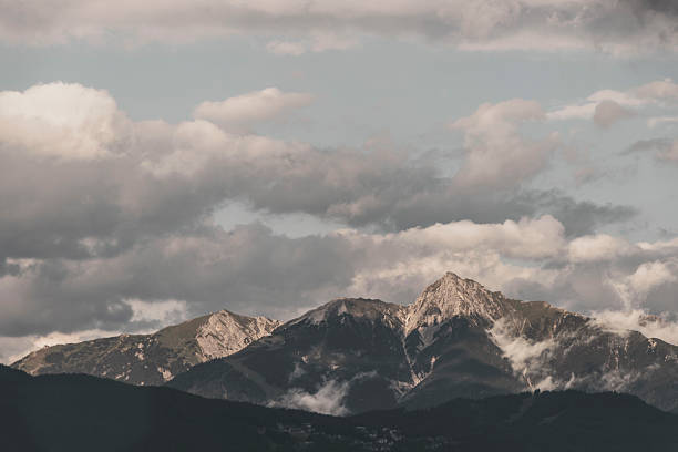 istock Mountain landscape mountains green fields forest clouds in Vorarlberg Austria. 2214033483