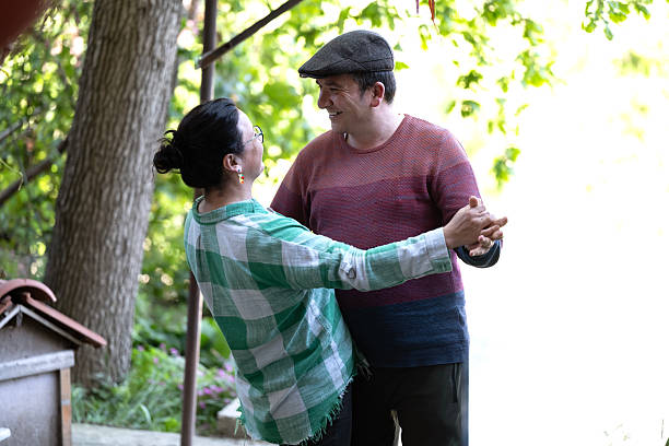 Happy couple dancing outdoors