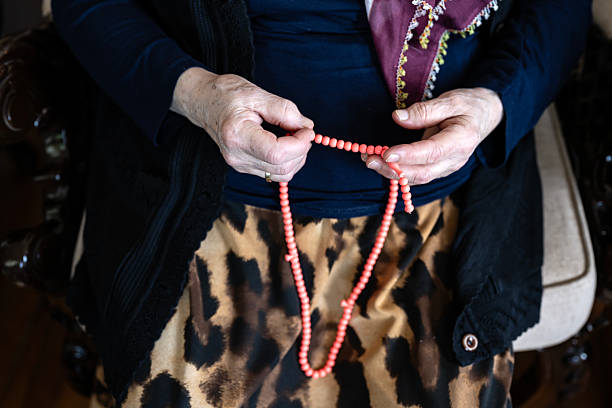 Senior muslim woman praying at home