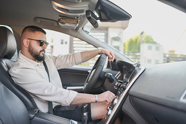 istock Male Driver Turning Down Car Music While Parking 2214036735