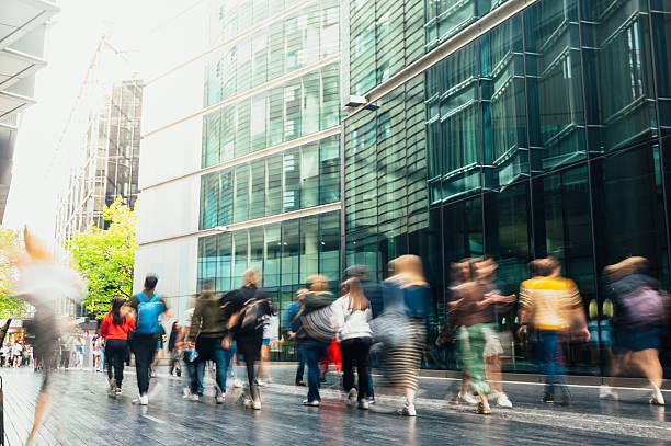 People in blurred motion on a city street