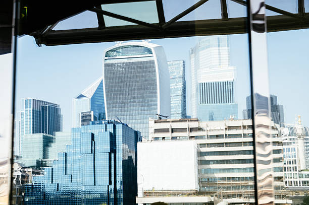 Reflection of skyscrapers in central London on a window