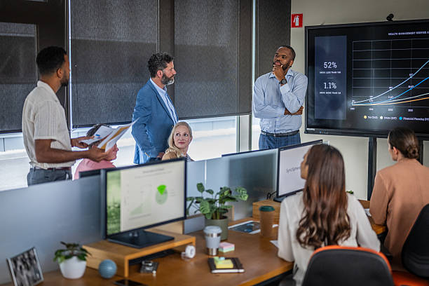 istock Diverse Business Team Analyzing Financial Growth Data During Strategic Meeting In Modern Office 2214037378