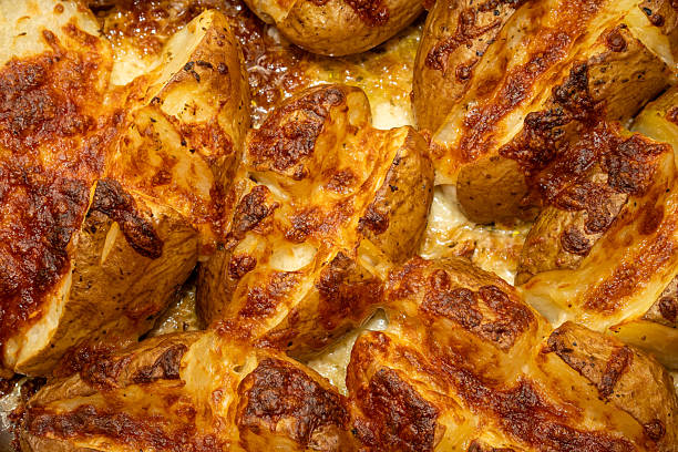 istock Roasted Potatoes with Butter and Mozzarella Cheese 2214038817