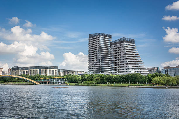 istock Stunning Modern Architecture Overlooking Serene Waterfront with Lush Greenery 2214041676