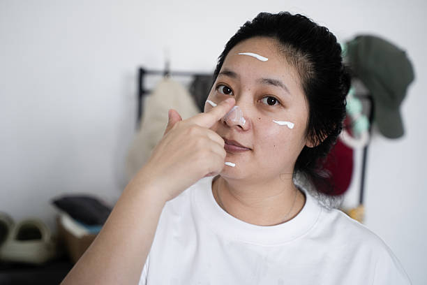 istock Asian women applying sunscreen 2214043028