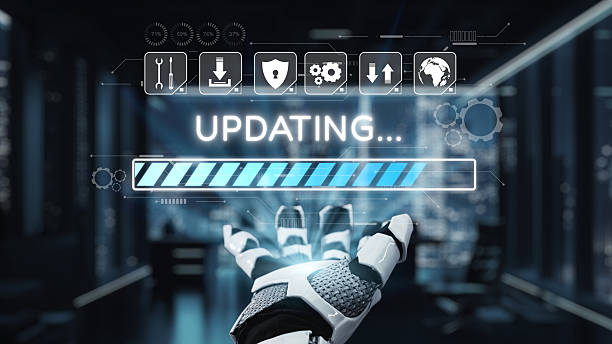 istock Futuristic robotic hand displaying progress bar with updating status in a high-tech digital environment emphasizing technology and innovation. Auvana 2214045003