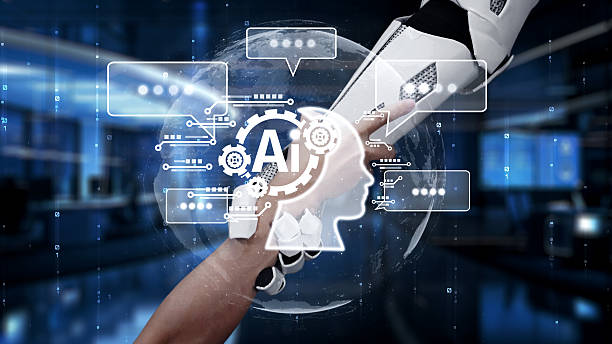 istock Futuristic Collaboration Between Human Hand and Robotic Arm in a High-Tech Environment with AI Elements Representing Technology and Innovation. Auvana 2214045566