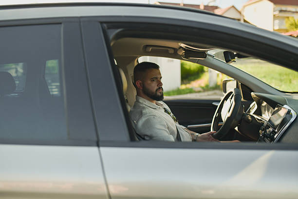 istock Serious-Looking Man Driving Peacefully Comfortable and Focused Behind the Wheel 2214045890