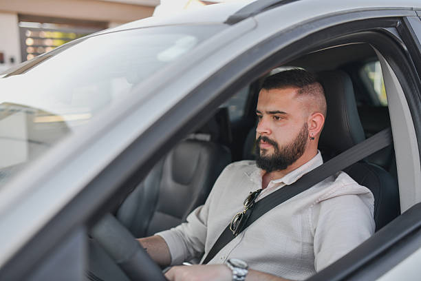 Confident Man Enjoying Peaceful Car Journey With Cool Collected Demeanor