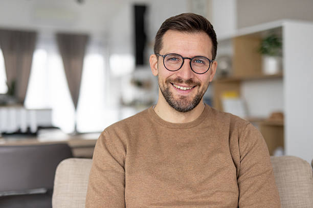 istock Friendly man posing cheerfully for a joyful family photo 2214048093
