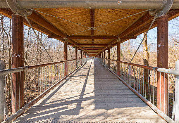 istock Wooden St Emmeram bridge across Isar river at Munich 2214048552