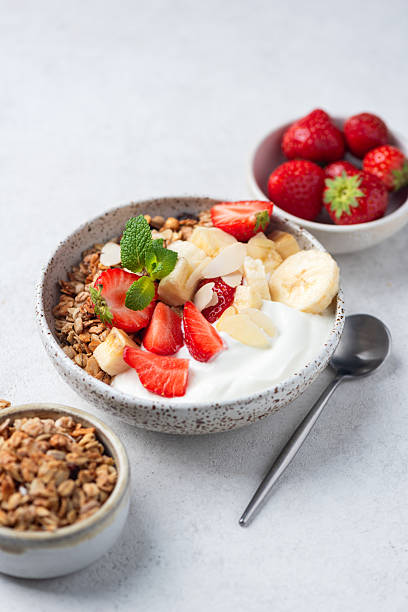 istock Granola yogurt bowl with strawberries, banana 2214049580