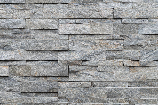 istock Texture of gray brick slate stone wall surface 2214051633