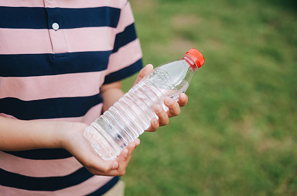 istock Child Holding Purified Water 2214051996