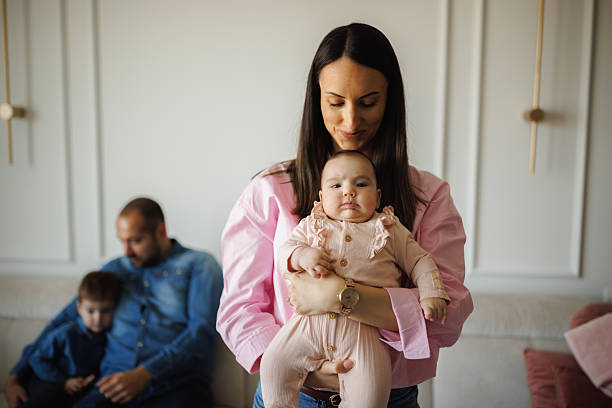 istock Mom Holding her Baby Daughter 2214052069