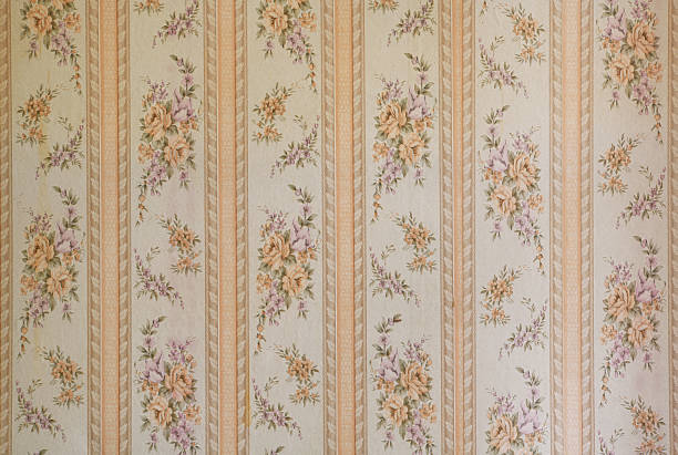 istock Old wallpaper on the wall. Old wallpaper for texture or background. 2214054573