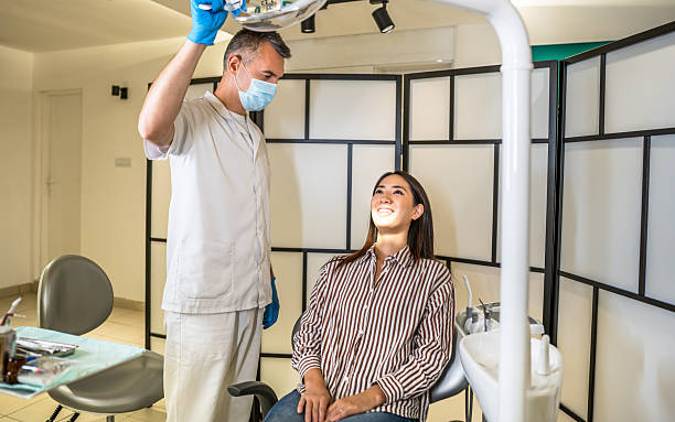 istock Dentist examining patient's teeth in modern dental clinic 2214056062