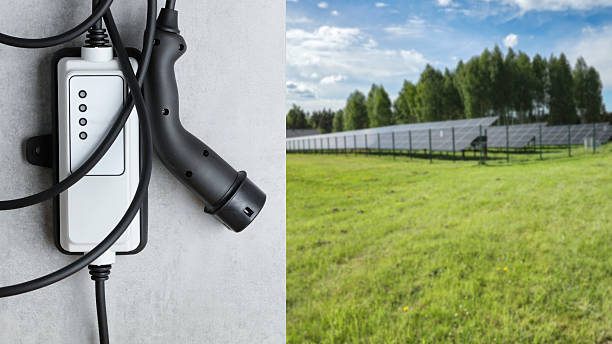 istock Electric Vehicle Charging Plug and Solar Panels on Grass – Renewable Energy Concept 2214059346