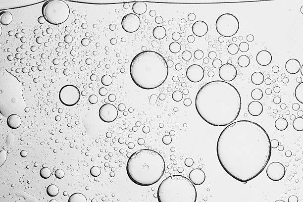 istock Texture, background, macro soda bubbles,Refreshing soda water with ice cubes against white background, closeup 2214063716