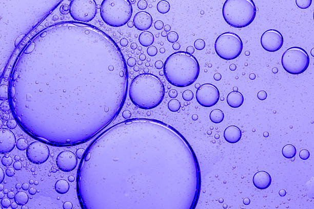 istock Macro purple bubble texture,Purple macro science bubble texture,Purple Science Experiment Bubble Texture Macro,Pipette with serum, gel, oil or other cosmetic product. 2214063720