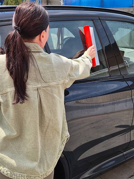 istock young woman washing car 2214065507