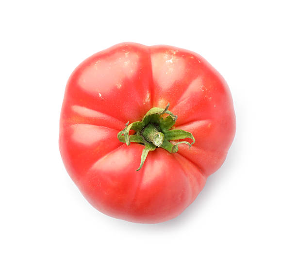 istock Fresh ripe tomato isolated on white, top view. Effect of poor cultivation 2214072615