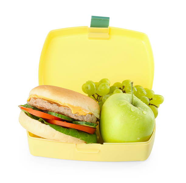 istock Plastic lunch box with burger and fresh fruits isolated on white 2214074364