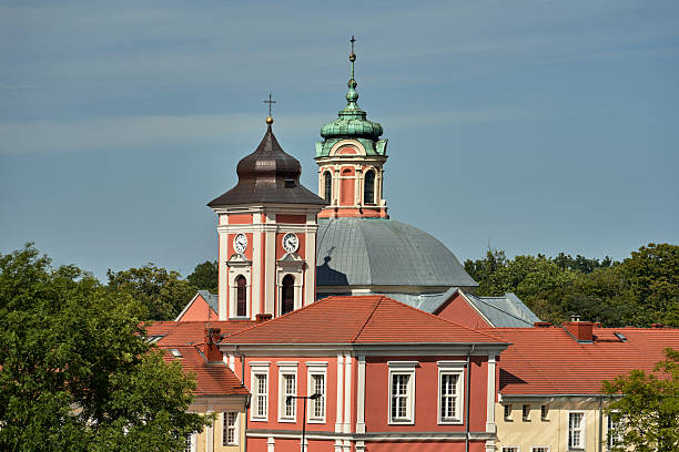 istock Historic Church in Classicist Style with Clock Tower in Owinska 2214076812