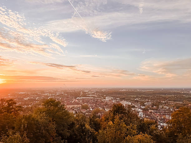 istock Beautiful sunset over a city with a clear blue sky 2214077380